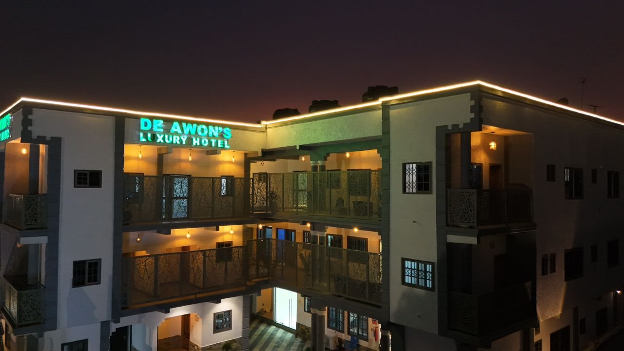 De Awon's Luxury Hotel facade at night
