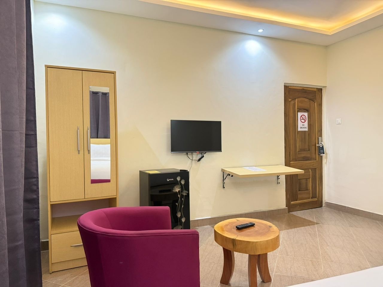 Standard room — wardrobe, TV & seating